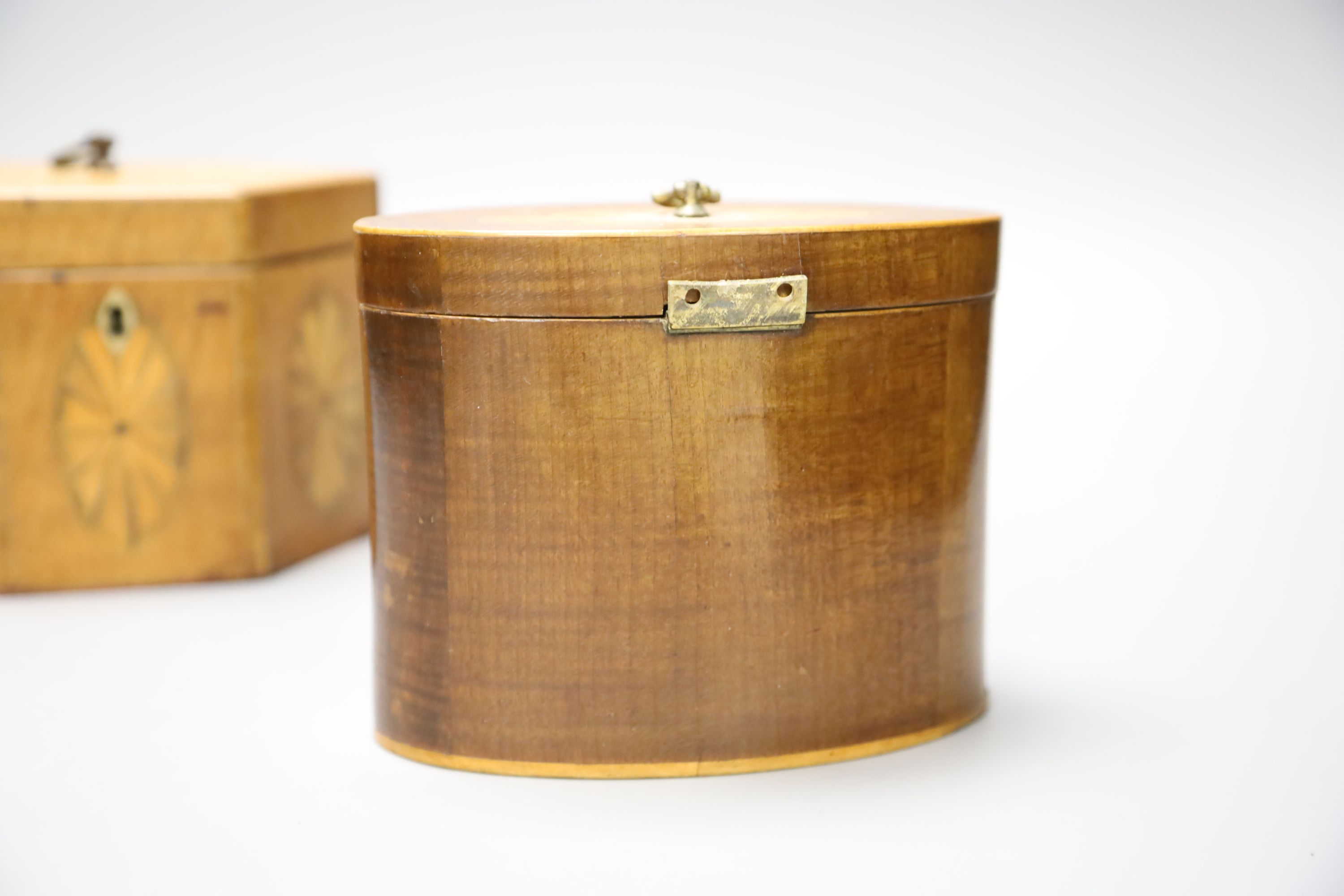 A George III oval marquetry tea caddy and a hexagonal caddy. tallest 11.5cm